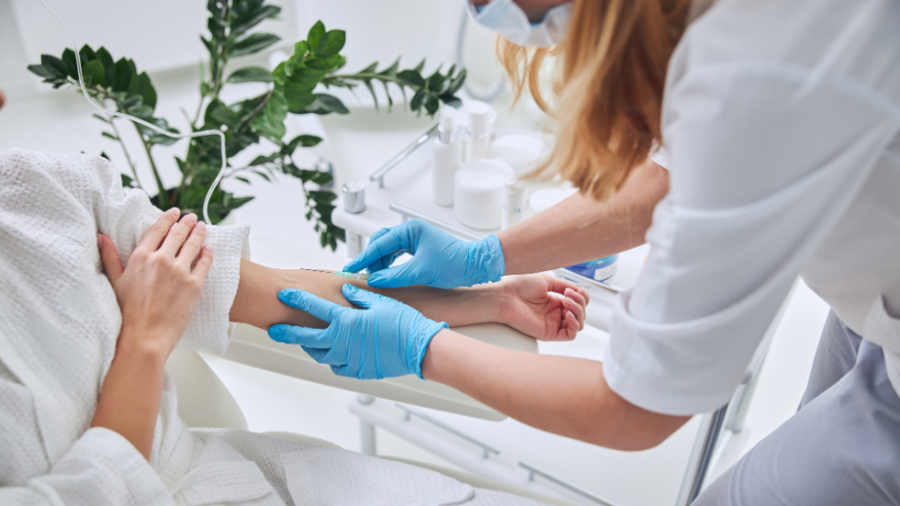 doctor giving IV infusion